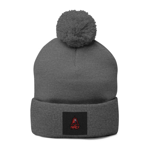 Embroidered Pom-Pom Knit Cap — Cozy Winter Beanie with Small Red Triangle Patch