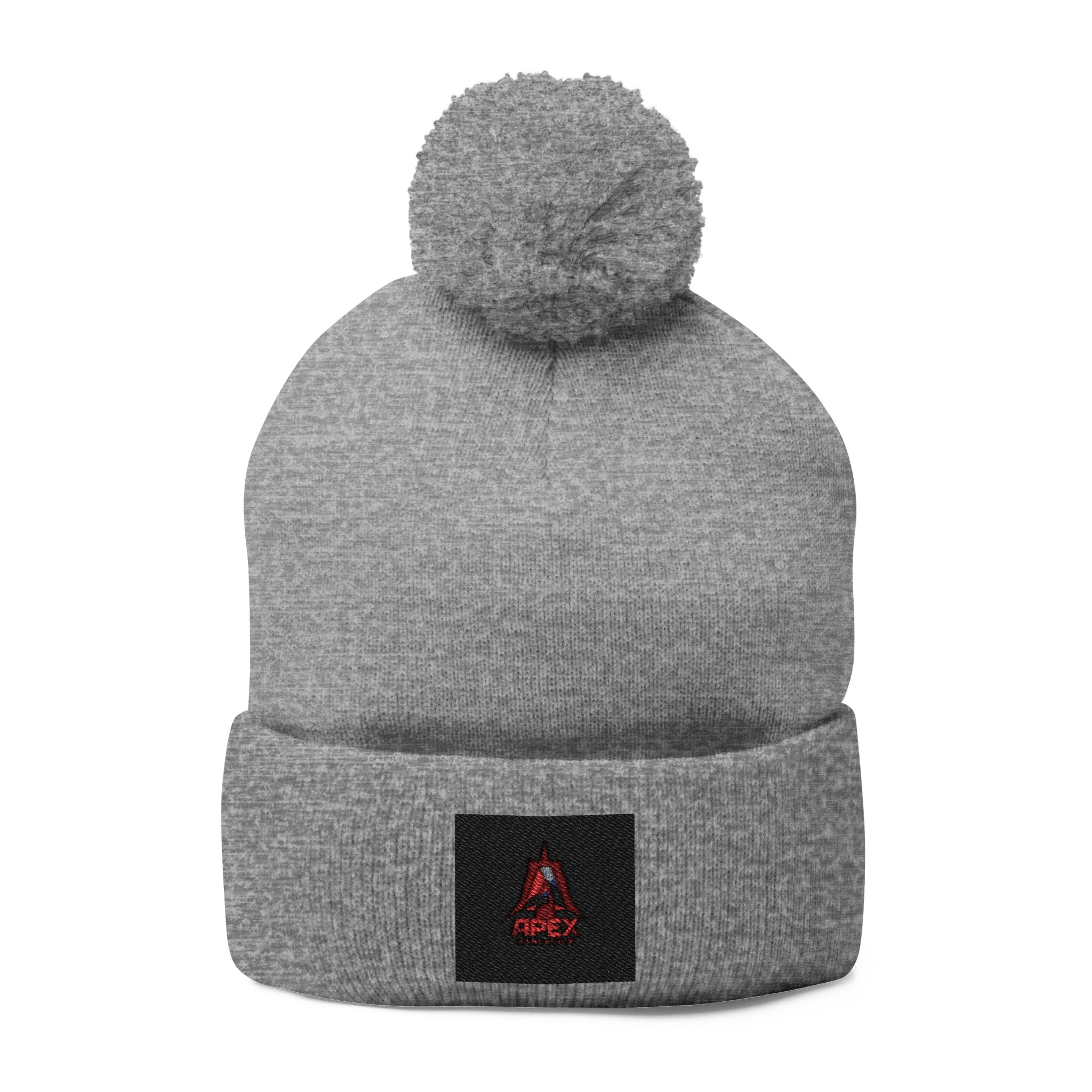 Embroidered Pom-Pom Knit Cap — Cozy Winter Beanie with Small Red Triangle Patch